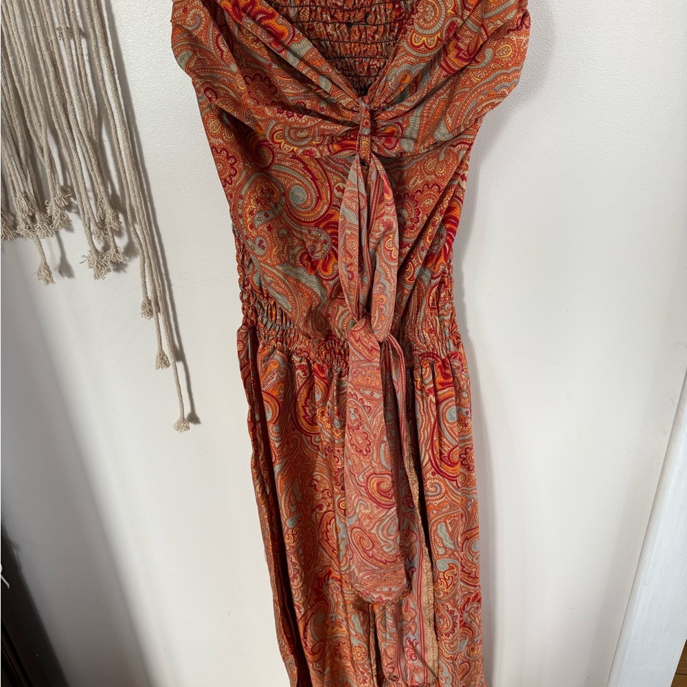 Vibrant Orange and Red Jumpsuit with Sleek Design